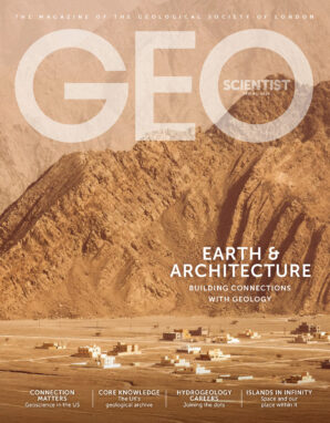 Magazine cover featuring a Middle Eastern rockscape and buildings