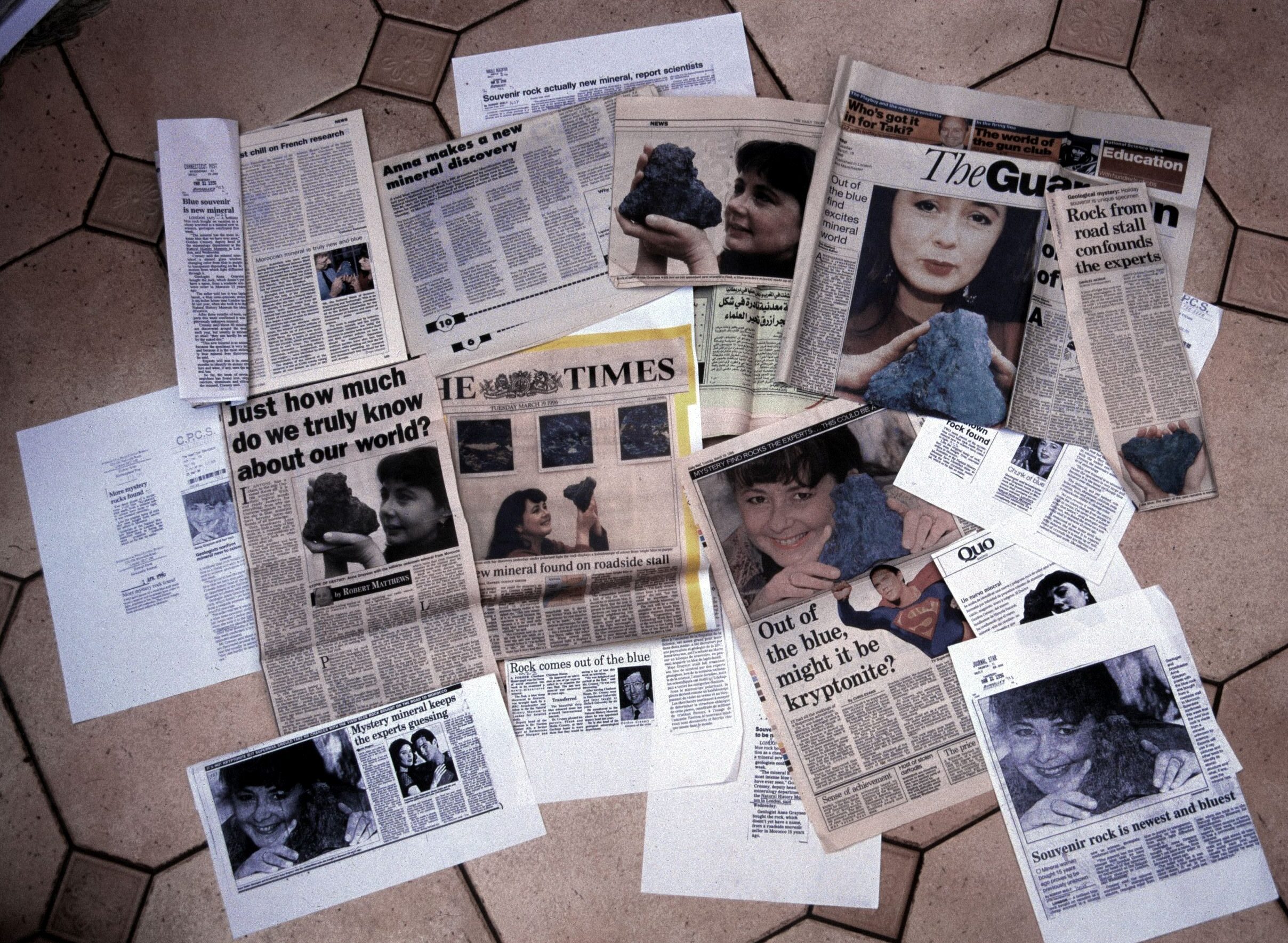 News paper cuttings from the 1990s spread across a floor