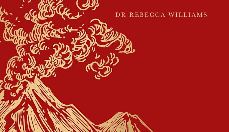 A red book cover shows the outline of volcanoes billowing smoke in gold foiling.