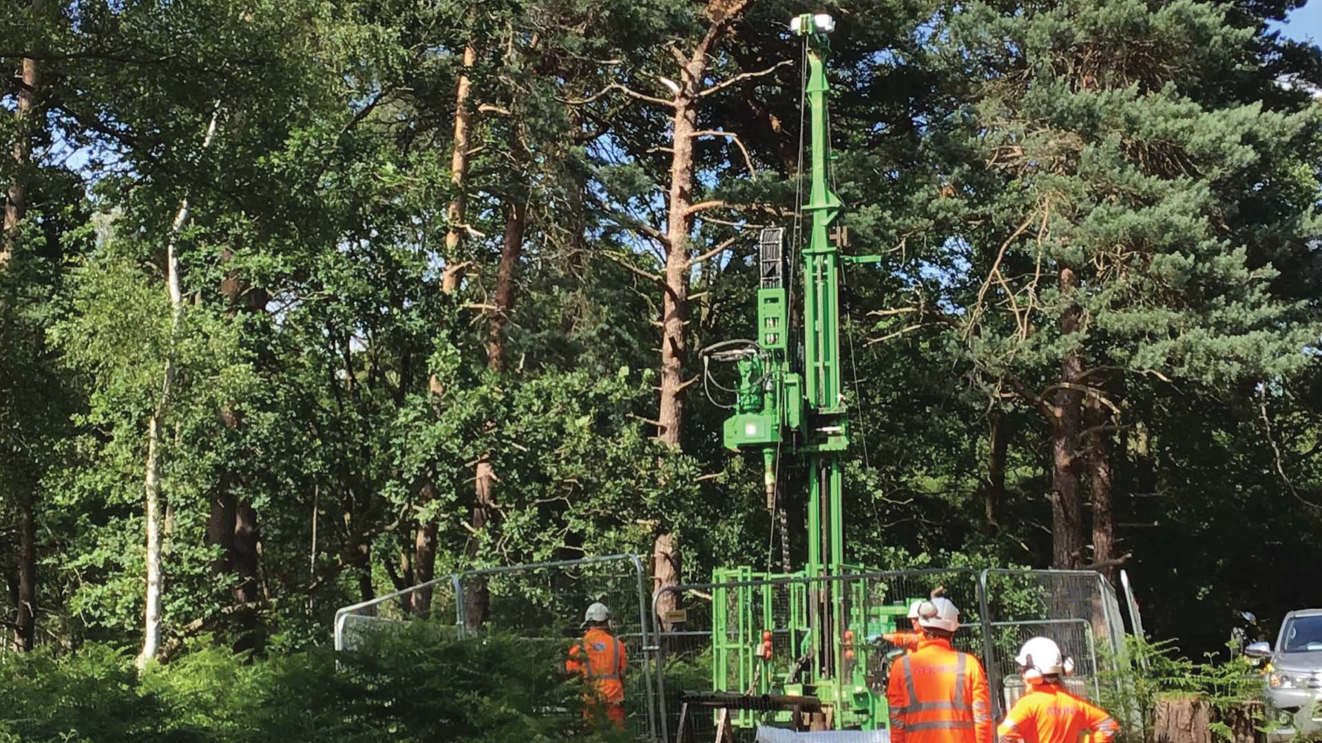 Geological Engineers in hard hats and bright work gear in the field
